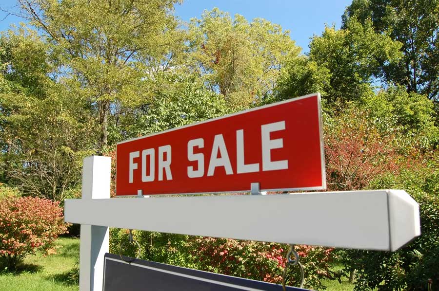 For Sale sign of home listing with Your Home Solod Guaranteed Realty.