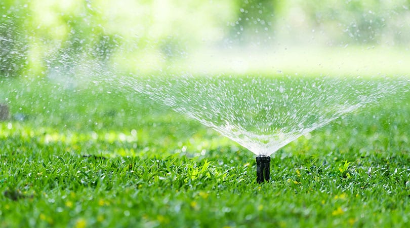 Irrigation System- The application of water to the landscape (plantings, Beds, garden areas, lawn areas etc.) through an artificially created system