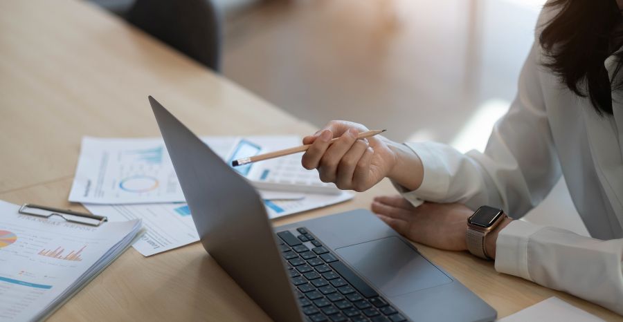 Accountant using a calculator to calculate the numbers. Accounting , Accountancy from financial report and calling to consultant, Calculation Concept.
